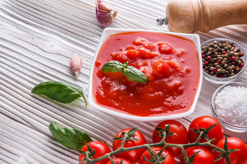 juicy canned tomatoes on wooden rustic background