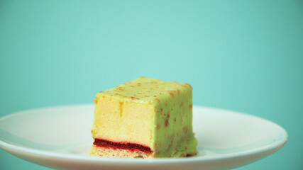 the cut cake rotates on a white plate