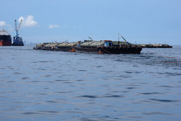 Fototapeta premium Sand carrier boat in the sea