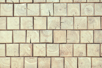 Obraz premium Wooden brick wall. Natural wood texture of square shape. Mosaic of bars. Vintage, abstract pattern. Old retro floor. Dark surface of squares. Rustic style.