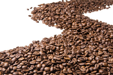 Roasted coffee beans isolated on white background. Close up of a brown surface texture of aroma black caffeine drink ingredient for coffee beverage.