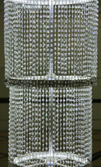 Huge crystal chandelier made of white transparent crystals