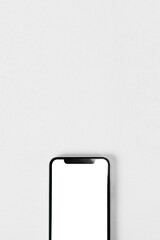 Blank smartphone on white background. Photo.  白背景の上のスマホのブランク素材。写真