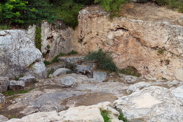 The abandoned grave of one of the wives of King Herod in the territory of the public Bloomfield Park in the light of the rays of the setting sun in Jerusalem, Israel