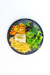 cod fish with vegetables, small vegetables and marine sauce