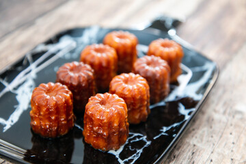 Canele is a small French pastry with rum and vanilla