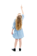 Back view of little girl pointing up above her. Rear view. Isolated on white background 
