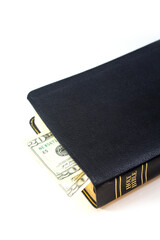Holy Christian Bible with Money Isolated on White