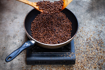 Traditional roasting coffee at home,  freshly roasted coffee beans.