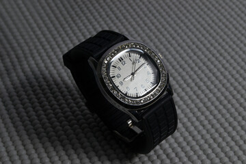 black watch on a gray background
