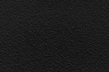 black concrete stone texture for background in black.  Cement and sand grey dark detail covering.