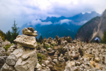 Stone tower made by tourists in mountains.
