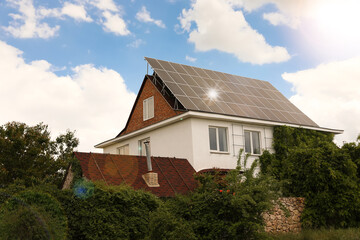 Building with installed solar panels on roof. Alternative energy source