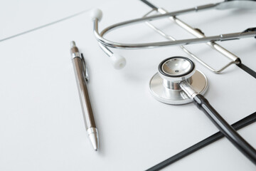 Stethoscope, Document Board, Notebook, Pen  on white background and copy space