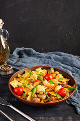 Stir fry farfalle pasta with vegetables, cauliflower and mushrooms