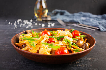 Stir fry farfalle pasta with vegetables, cauliflower and mushrooms