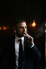 businessman sits in office with cigar