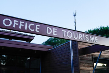 office de tourisme sign text in French means tourism office on wall agency in France