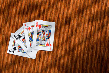 Four of a kind playing cards king, poker card in orange background.
