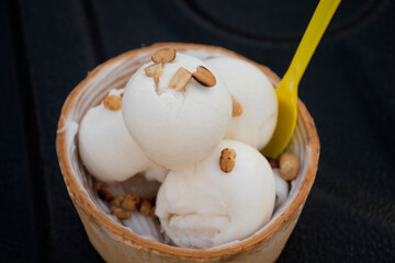 
Coconut ice cream in a beautiful white sailor