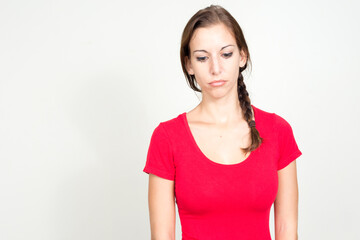 Portrait of stressed young woman with brown hair looking sad