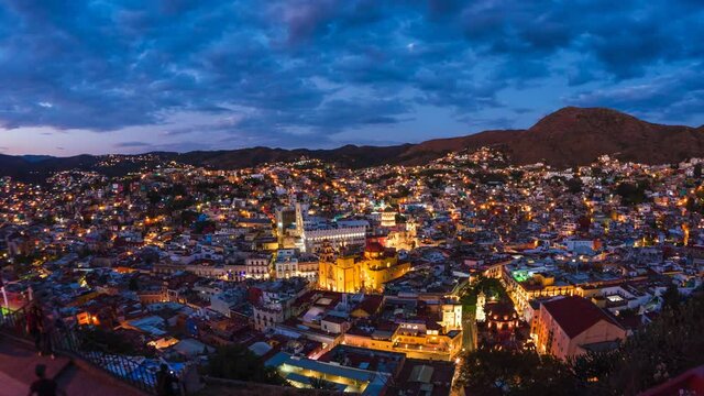 Guanajuato City, Mexico, day to night timelapse view of cityscape including historical landmark Basilica of Our Lady of Guanajuato and surrounding mountains.