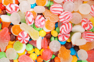 Fototapeta na wymiar Mixed colorful fruit candies and jellies