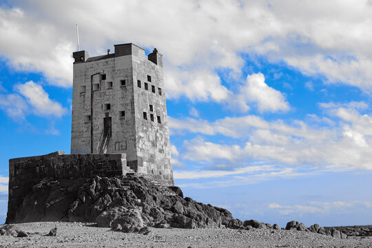 Image Of Seymour Tower At Low Tide With Stones, Mono Tone With Blue Sky