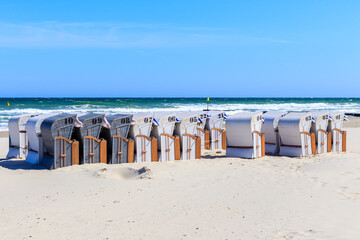 Beach chairs on beautiful white sand beach in Kolobrzeg town, Baltic Sea coast, Poland