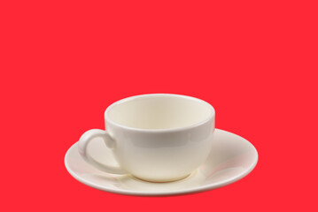 Empty cup on a red background.