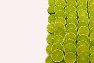 Fresh lime slices as a background.