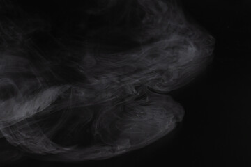 White steam on a black background.