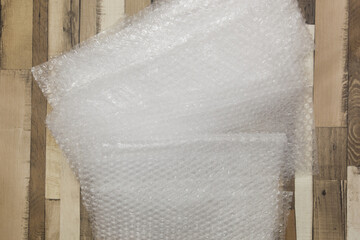 Bubble wrap on the wooden floor.