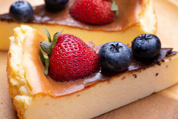 Fresh berries blueberries with Strawberry on top of the cheesecake