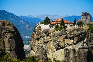 Fototapeta na wymiar View of the cliffs of Meteora, ancient Christian monasteries, a place of pilgrimage. Popular tourist route.