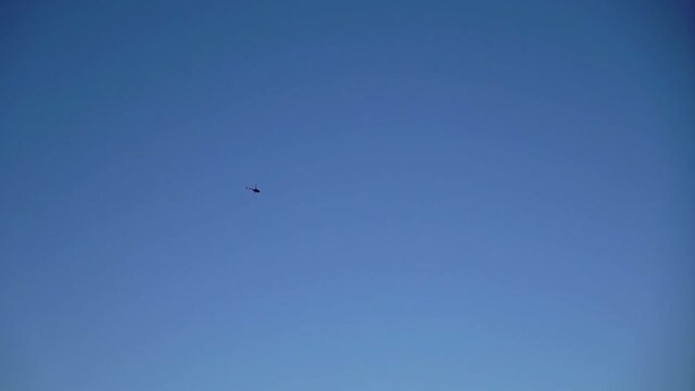 Helicopter flying and landing at airport airfield