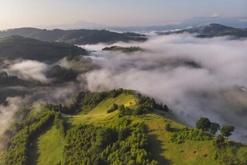 Aerial foggy landscape in Transylvania, at sunrise