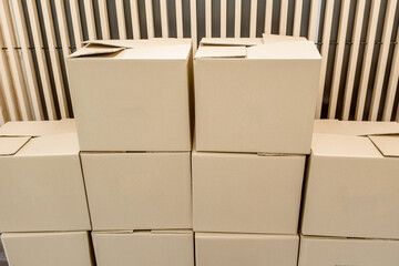A lot of cardboard boxes in a office