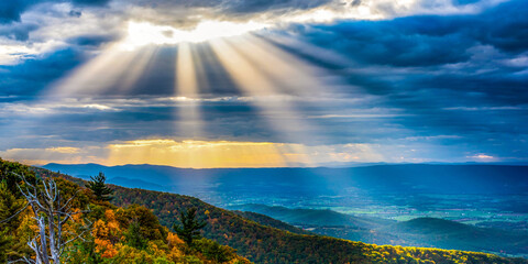 Shenandoah National Park at sunset with sunrays shining through clouds