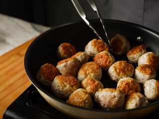 Cutlet meatball with farm minced meat cooking homemade with vegetables, herbs, spices and other ingredients by family recipe  on home kitchen background with ingredients