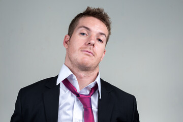 Portrait of handsome businessman in suit looking at camera