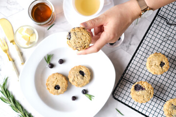 Blueberry scones. a Traditional British baked good for tea time. set on cafe table.