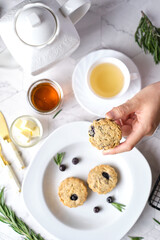 Blueberry scones. a Traditional British baked good for tea time. set on cafe table.