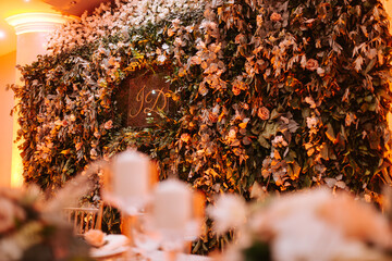 A beautiful romantic wall of real fresh flowers. Decoration for the celebration