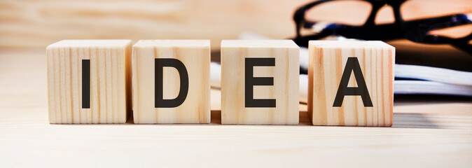 IDEA Word Written In Wooden Cube. IDEA text concept.