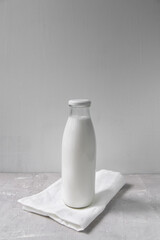 Bottle of milk on a net background, minimalism