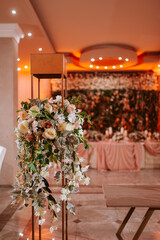 Beautifully romantically decorated hall for a special event. Floral decoration for celebration