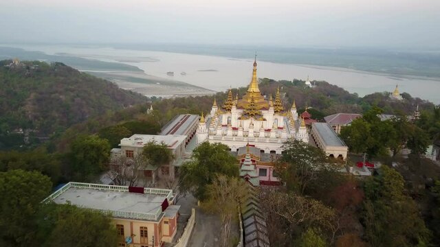 Aerial shot over pagoda at the top of the sagaing's hills near Mandalay, Myanmar