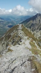 A mountain trail going through a peak