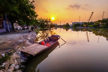 Hai Phong, Vietnam  Sep 2015 sunset at Tam Bac river bank with mirror water surface 